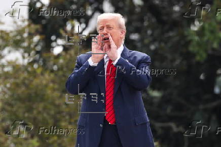 US President Trump walks on roof of the West Wing of the White House