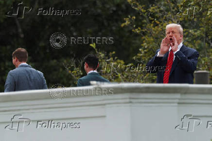 U.S. President Trump and architect McCrery on a walk on the roof of the White House in Washington