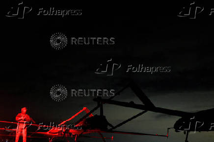 FILE PHOTO: Commander of the 14th UAS Regiment with the call sign 'Charlie stands next to deep strike drone before launching it toward Russian territory, in Ukraine