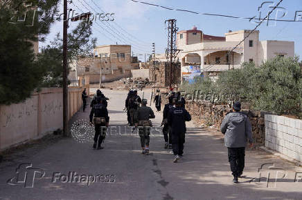 Syrian security forces deployed in the village of Al-Soura al-Kubra