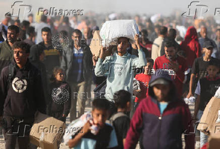 Palestinians receive aid from the U.S.-backed Gaza Humanitarian Foundation, in Khan Younis