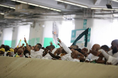 Muslim pilgrims hurl stones during 'stoning of the devil' ritual, in Mina