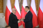 Polish President-elect Karol Nawrocki receives the winning certificate