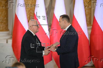Polish President-elect Karol Nawrocki receives the winning certificate