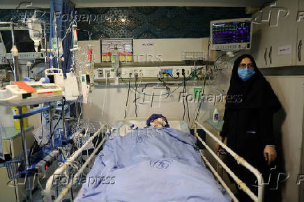 An injured girl is treated in a hospital, in Tehran