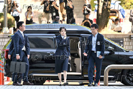 South Korea's former first lady Kim Keon Hee arrives at a court to attend a hearing to review her arrest warrant, in Seoul