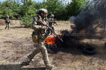 Ukrainian service members attend a military drill near a frontline, in Zaporizhzhia region