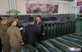 North Korea's leader Kim Jong Un visits a factory that makes shells and machinery