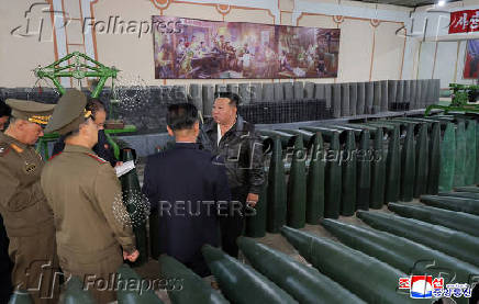 North Korea's leader Kim Jong Un visits a factory that makes shells and machinery