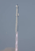 SpaceX's next-generation Starship spacecraft atop its Super Heavy booster is prepared for launch
