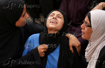 Funeral of Palestinians killed on Sunday by Israeli fire while seeking aid in northern Gaza, according to Gaza's health ministry, at Al-Shifa Hospital