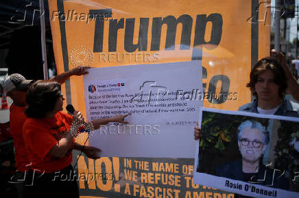 Protesters denounce U.S. President Trump for threatening to strip comedian Rosie O?Donnell of her citizenship, in Los Angeles, California