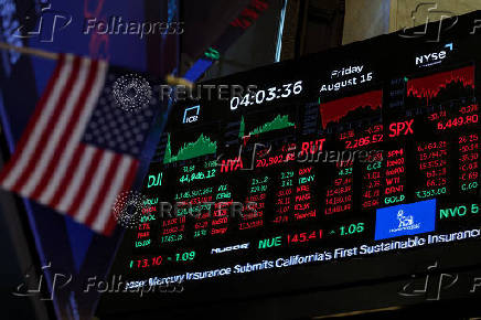 A screen displays indexes after the closing bell at the NYSE in New York