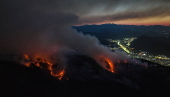 Wildfire burns near a residential neighborhood