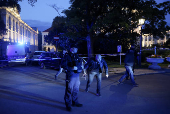 Polish police secure an earea at the Warsaw University after an attack with an axe