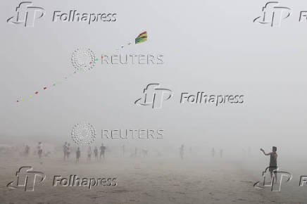 People enjoy the beach in West Wittering