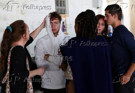 Relatives of Belgian nationals Lornoy David and Seppe Lodewijckx react after the hearing of their case where the two pleaded guilty to illegal possession and trafficking of garden ants, in Nairobi