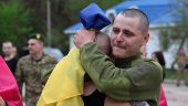 Ukrainian POWs are seen after a swap at an unknown location in Ukraine