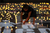 Family members and friends of missing persons participate in a candlelight vigil, in Mexico City