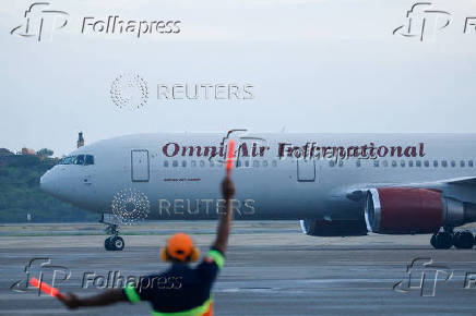 FILE PHOTO: Deportation flight with Venezuelan migrants from U.S. and Guantanamo lands, in Maiquetia