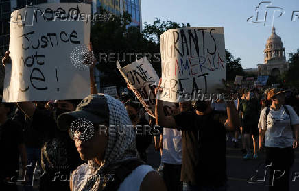 Rally in solidarity with Los Angeles protests against federal immigration sweeps, in Austin