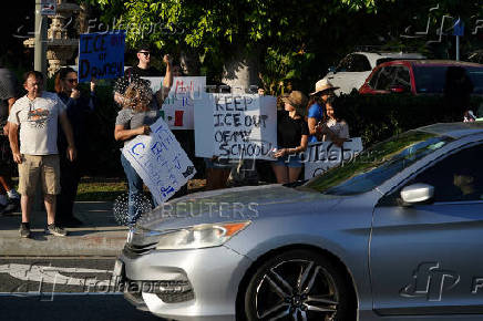 Protest against federal immigration sweeps, in Downey