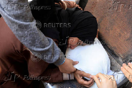 Funeral of Palestinians killed on Sunday by Israeli fire while seeking aid in northern Gaza, according to Gaza's health ministry, at Al-Shifa Hospital
