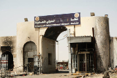 A view of a gate at Khartoum Airport with burned debris scattered around, in Khartoum