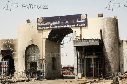 A view of a gate at Khartoum Airport with burned debris scattered around, in Khartoum