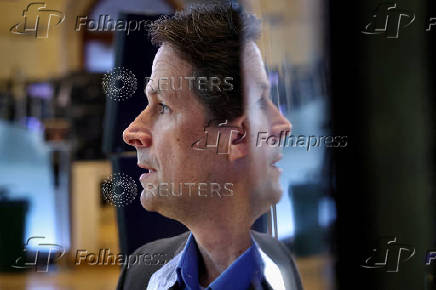 Traders work on the floor of the NYSE in New York