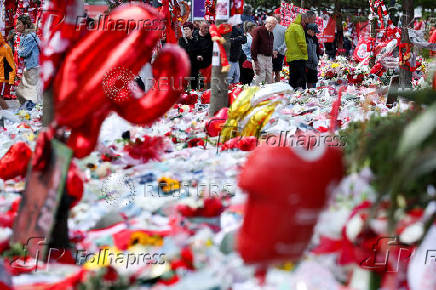 Fans pay their respects to late soccer player Diogo Jota, in Liverpool