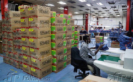 Kenyan workers prepare clothes for export at the United Aryan EPZ factory in Ruaraka district of Nairobi