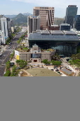 Workers plant lawn in front of Seoul City Hall