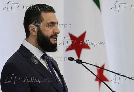 FILE PHOTO: Syria's interim President Ahmed al-Sharaa speaks during a Ministerial formation of the government of the Syrian Arab Republic, in Damascus