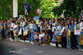 Relatives of Ukrainian prisoners of war wait for their arrival after a swap in an undisclosed location in Ukraine
