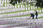 Flags placed on military veteran graves for Memorial Day in Brooklyn