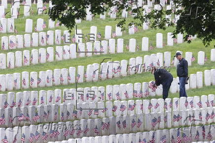 Flags placed on military veteran graves for Memorial Day in Brooklyn