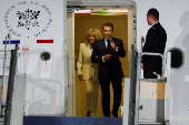 French President Emmanuel Macron and his wife, Brigitte Macron arrive at military airbase Halim Perdanakusuma in Jakarta