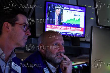 Traders work on the floor of the NYSE in New York