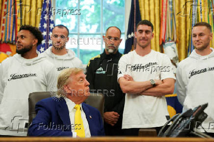 U.S. President Donald Trump meets with players of the Juventus soccer team at the White House in Washington
