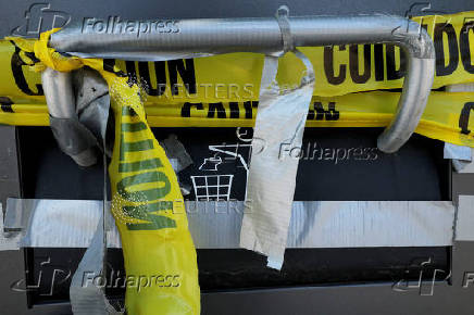Caution tape seals off public trash bins in Waltham