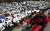 Workers perfom their duties at Quantum apparel factory on the outskirts of Maseru