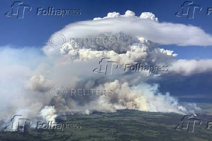 Smoke rises from wildfire G90216 north of Fort Nelson