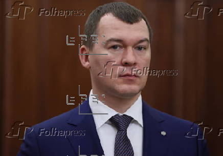 Russian President Vladimir Putin meets with Sports Minister Mikhail Degtyarev