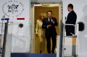 French President Emmanuel Macron and his wife, Brigitte Macron arrive at military airbase Halim Perdanakusuma in Jakarta