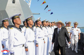 North Korean leader Kim Jong Un attends the launching ceremony of a warship that had been damaged upon its first attempt to launch