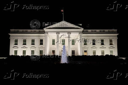 Member of the media report from the White House in Washington