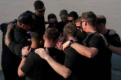 U.S. Army Golden Knights parachute team perform during the Twilight Tattoo ceremony