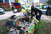 Tributes at place where Colombian Senator Uribe was shot during campaign event, in Bogota