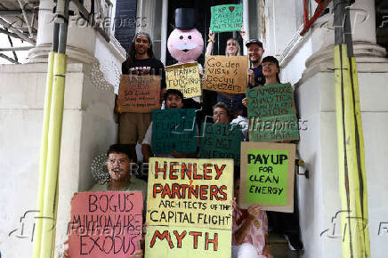 Green New Deal Rising protest outside Henley & Partners in London